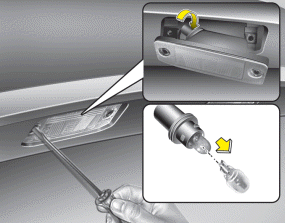 Hyundai Sonata: License plate light bulb replacement. 1. Loosen the retaining screws with a philips head screwdriver.