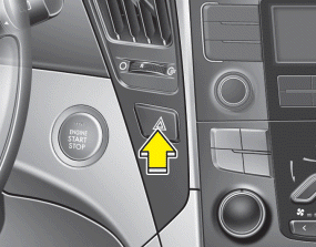 Hyundai Sonata: Hazard warning flasher. The hazard warning flasher should be used whenever you find it necessary to stop